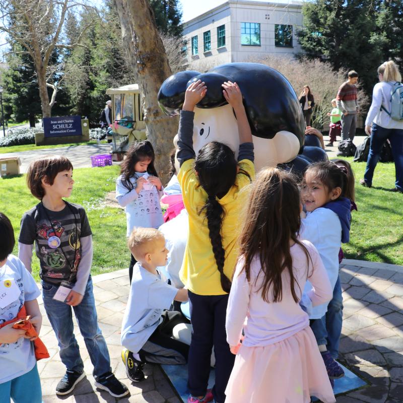Children Playing in front of Lucy Statue on SSU Campus