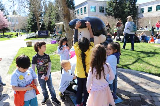 Children Playing in front of Lucy Statue on SSU Campus