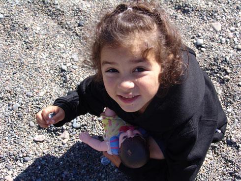 Little girl is holding rocks