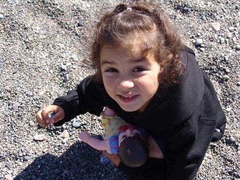 Little girl is holding rocks